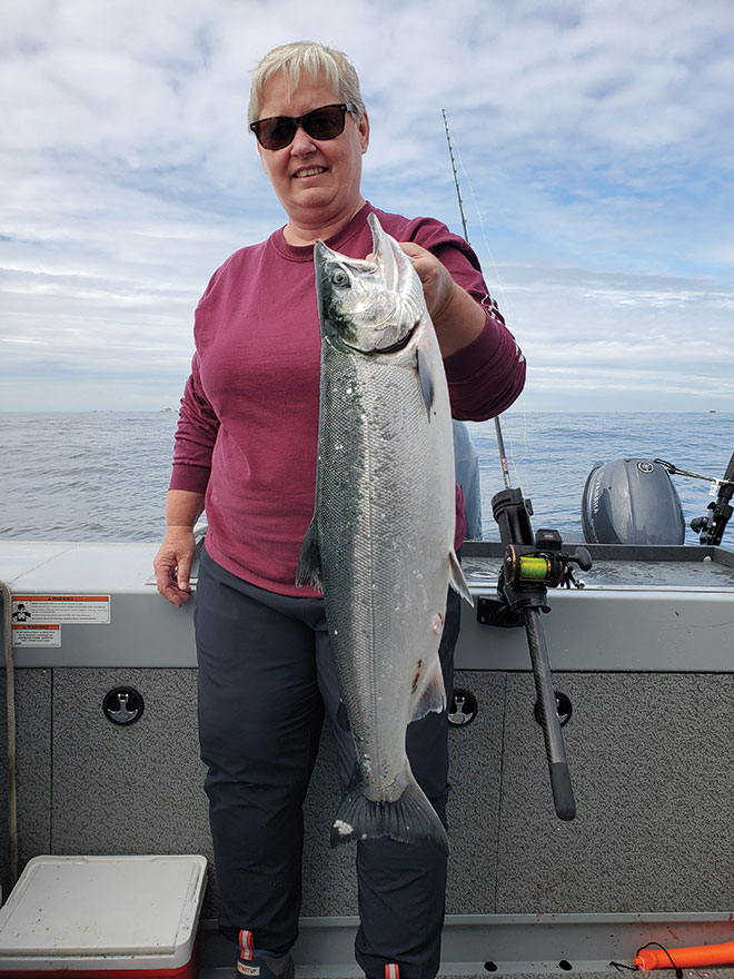 Fishing with Rod - A big fat silver coho salmon can make anyone